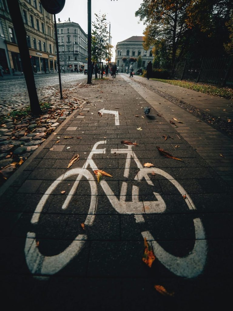 An autumn scene of a bicycle lane marked on a street in Riga, Latvia.